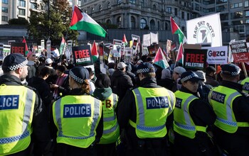 Tens of thousands of protesters march across Vauxhall Bridge